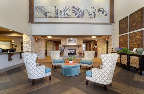 Cozy common area with armchairs and artwork