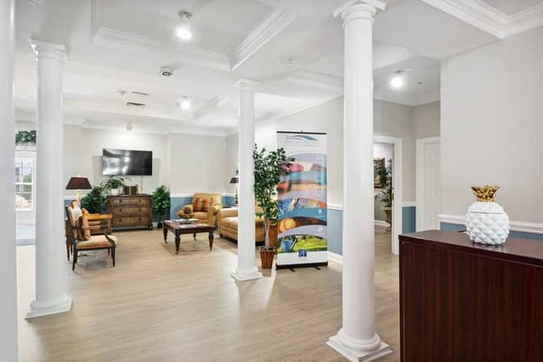 Bright and welcoming lobby with seating and decorative plants