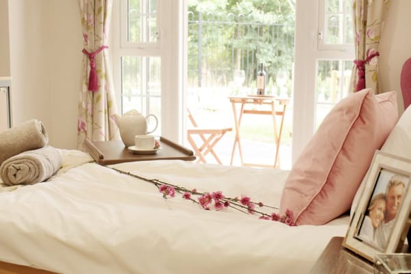 Cozy resident room with flowers on the bed