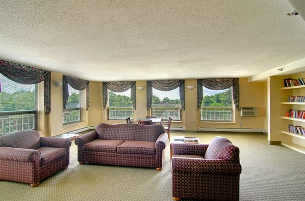 Cozy living room with comfortable seating and bookshelves