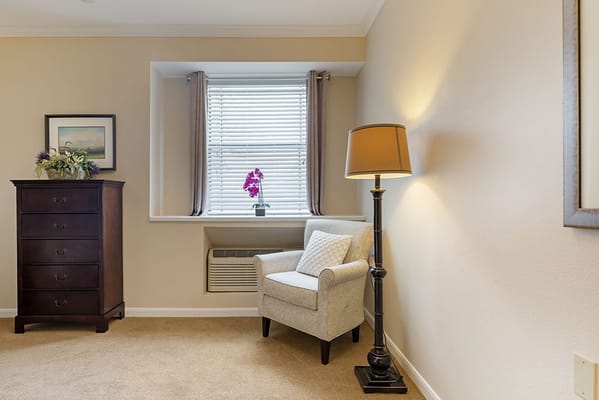 Cozy interior corner with a chair and lamp