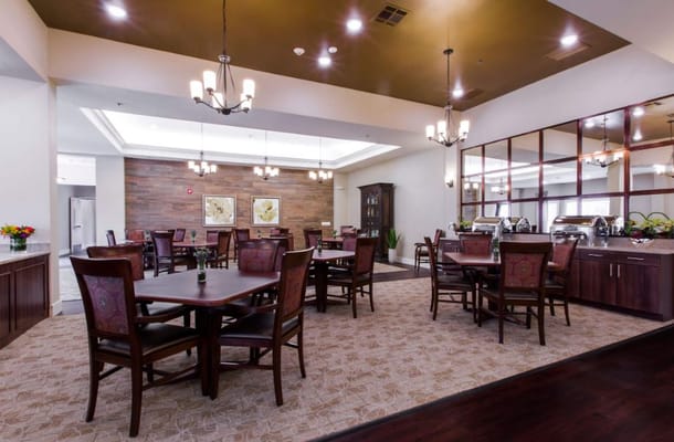 Bright dining room with wooden tables and chairs
