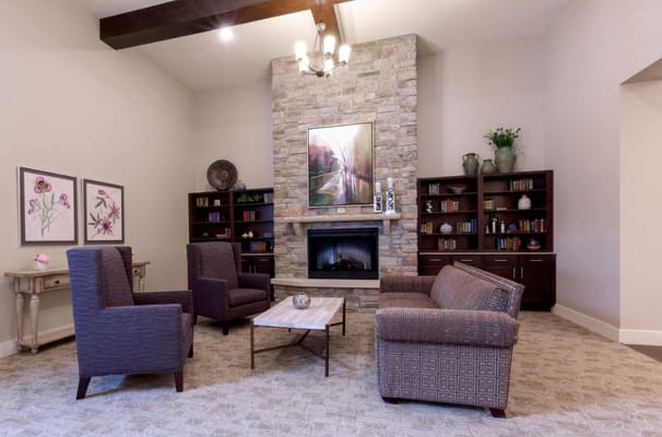 Cozy common area with seating and a fireplace