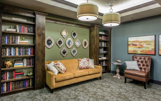 Cozy common area with bookshelves and seating