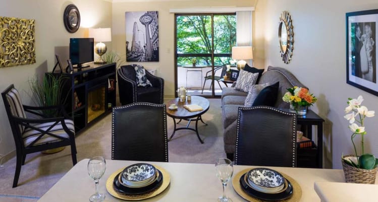 Comfortable living room with seating and a view of greenery