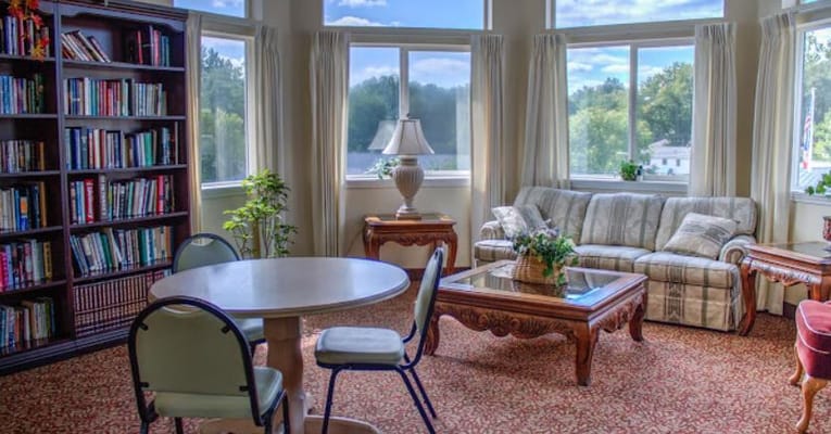 Bright common area with bookshelves and seating
