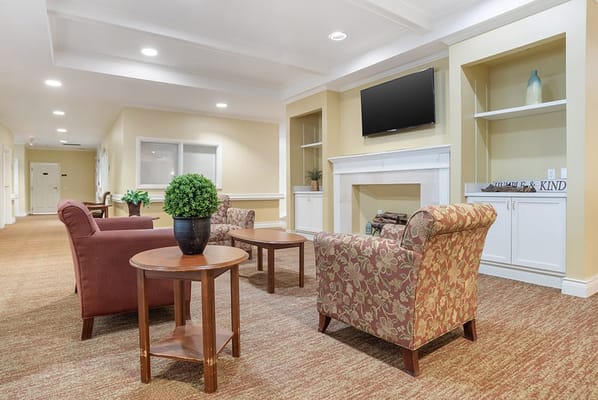 Interior view of a cozy common area with seating