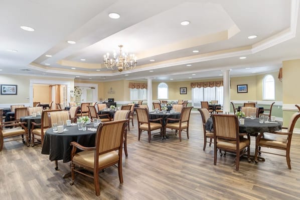 Dining room with tables set for residents