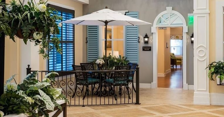 Outdoor seating area with umbrellas and plants