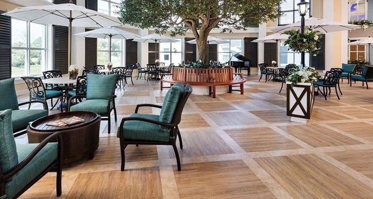 Bright common area filled with seating and natural light