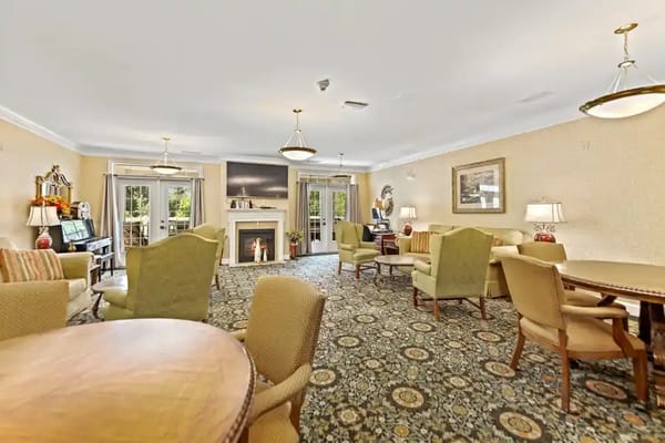Comfortable living room with seating and a fireplace at McCarthy Court