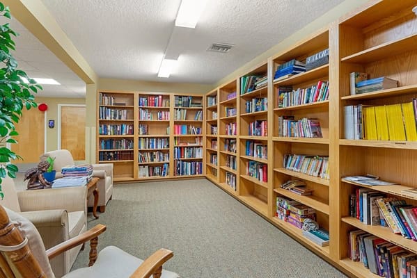 A cozy reading area with bookshelves and comfortable seating