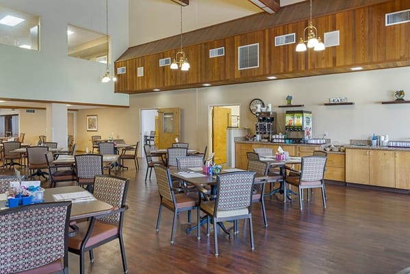 Bright dining room with tables and chairs