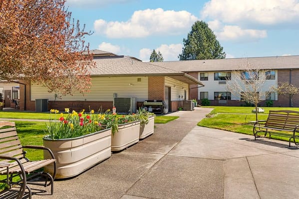 Outdoor space with flower planters and benches