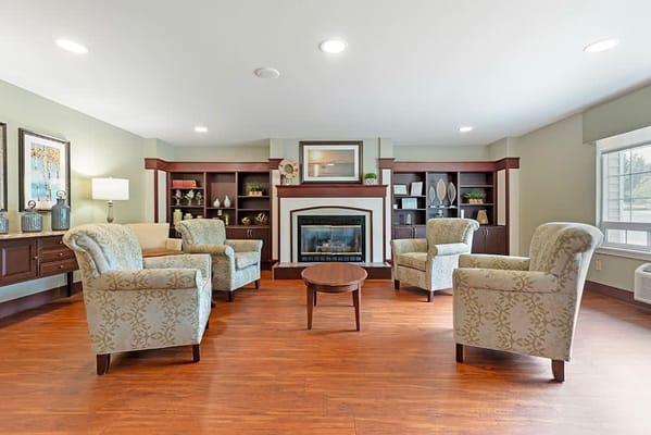 Cozy common area with seating and a fireplace