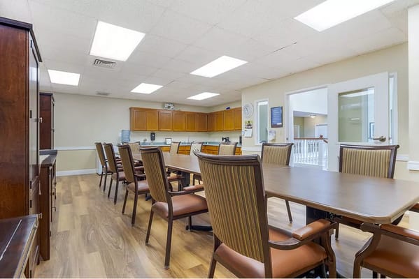 Interior view of a dining room with wooden tables and chairs