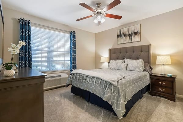 Cozy bedroom with a quilt and decorative accents