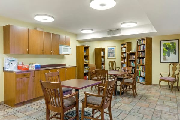 Common area with wooden tables and chairs