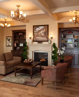 Cozy lobby area with seating and fireplace