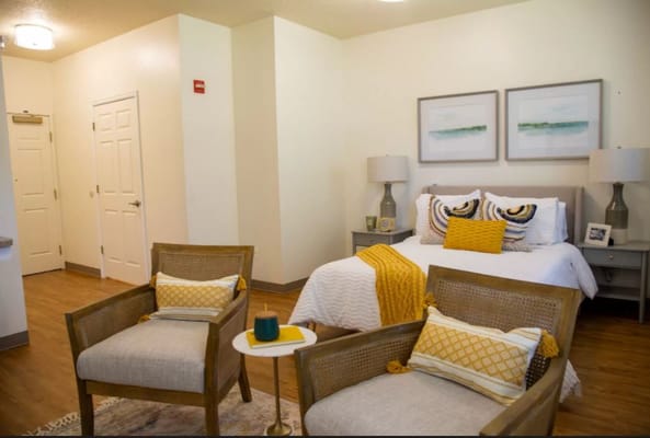 Cozy interior of a resident room with chairs and decor