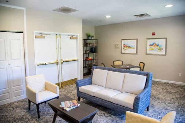 Bright common area with seating and art