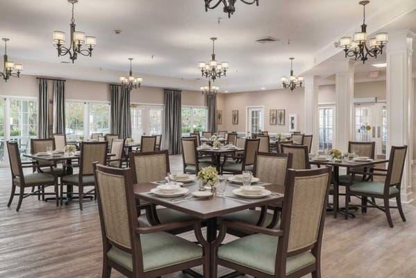 Spacious dining area with tables set for meals