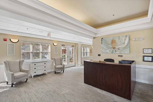 Welcoming reception area with comfortable seating and natural light.