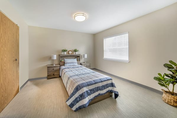 Bright interior room with a bed and decor