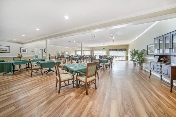Interior view of a dining room with tables and chairs