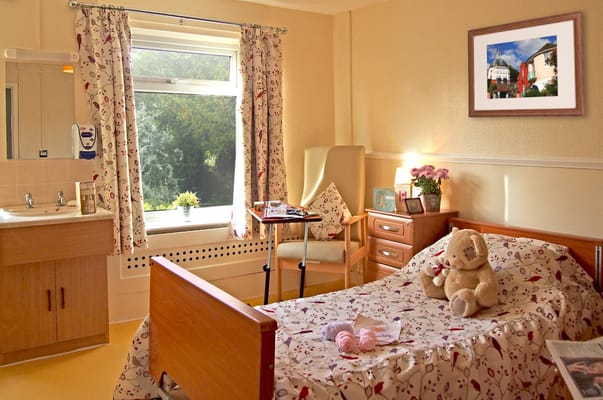 Cozy resident room with a bed and a window