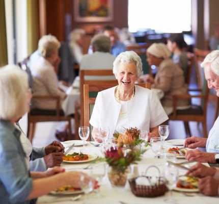 Residents enjoying lunch together in the dining room