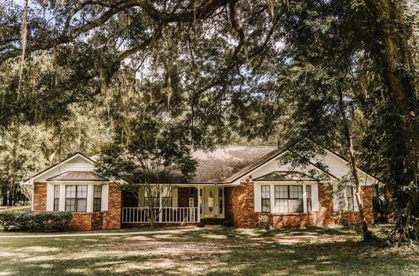 Exterior view of a residential home with trees