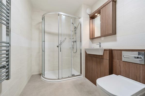 Contemporary bathroom with shower and vanities.