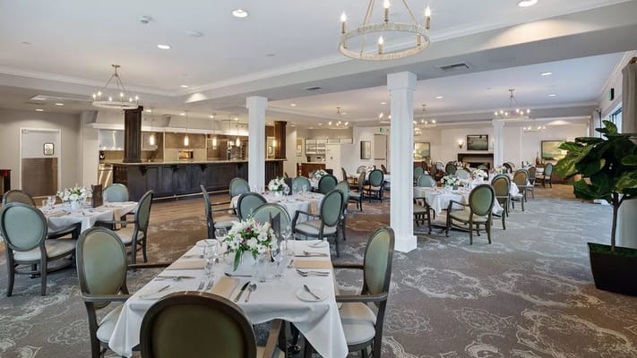 Elegant dining area with tables set for a meal
