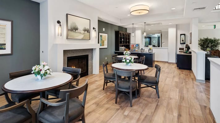 Bright common area with tables and chairs
