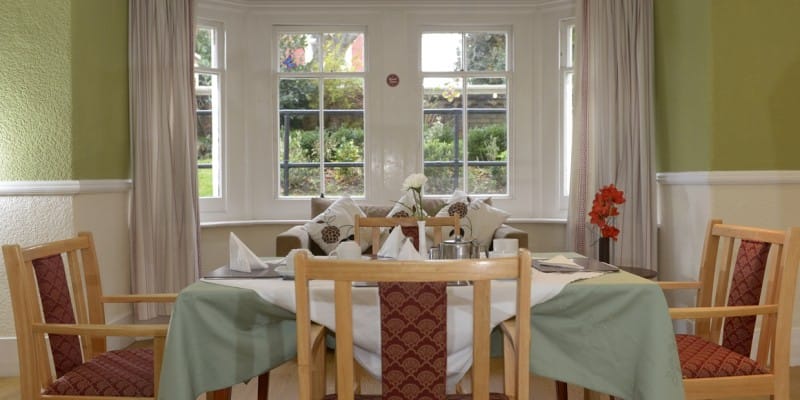 Bright common area with large windows and seating