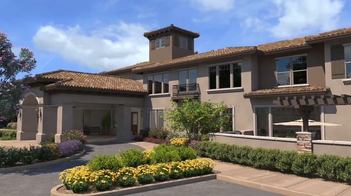 Exterior view of Oakmont of Concord with flowerbeds