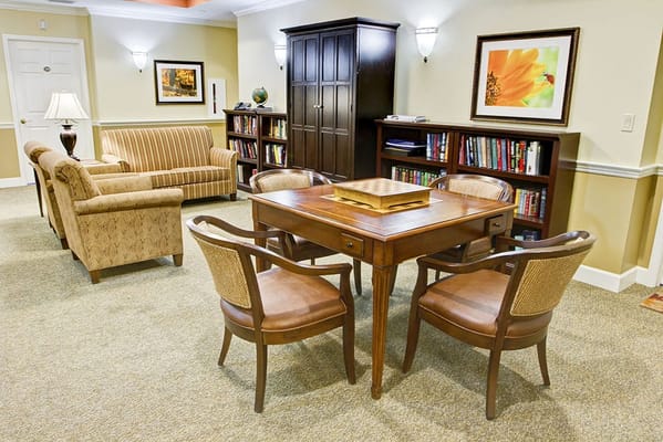 Cozy common area with seating and bookshelves