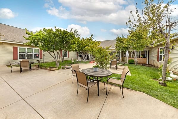 Outdoor courtyard with seating and greenery