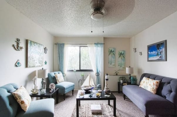 Bright and cozy common area with seating and decor