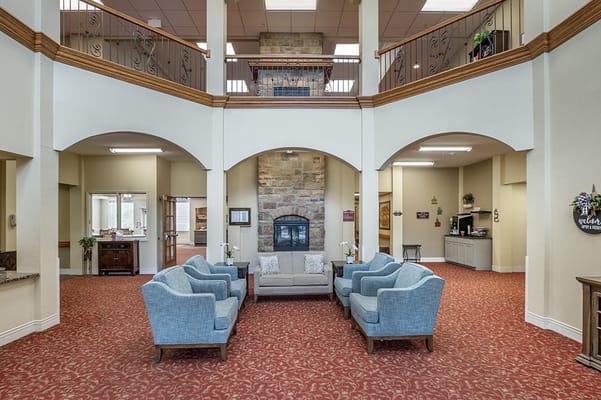 Bright common area with seating and fireplace