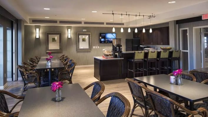 Interior dining area with tables and flowers