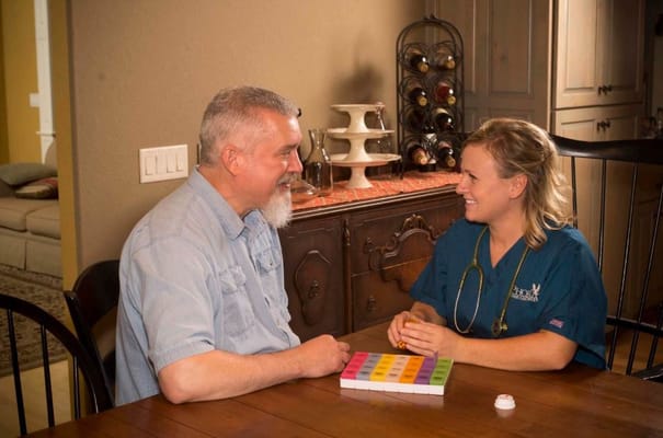 Staff member engaging with a resident during an activity