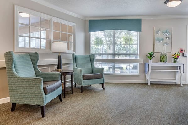 Cozy lounge area with armchairs and natural light