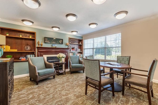 Interior common area with seating and bookshelves