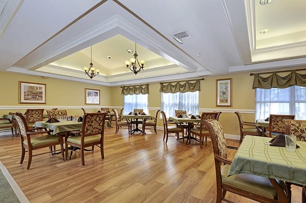 Dining area with tables and chairs for residents