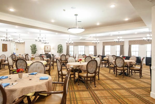 Bright dining room with round tables and chairs
