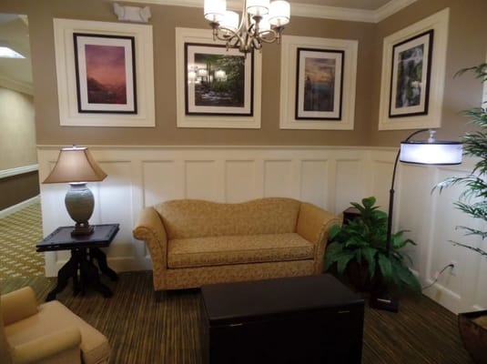 Cozy common area with seating and wall art