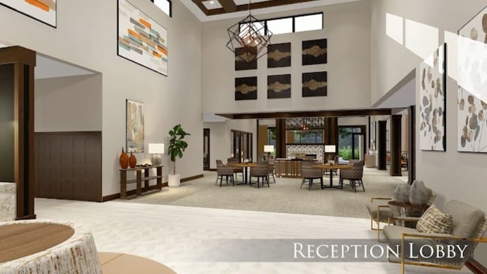 Bright and spacious reception lobby with seating and artwork