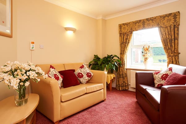 Cozy lounge area with comfortable seating and natural light